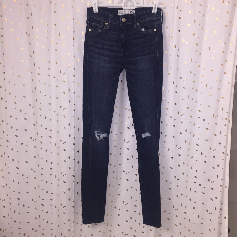 Dark blue distressed jeans